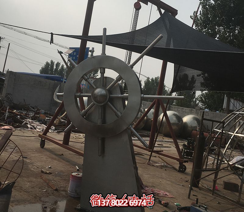 騰飛不銹鋼雕塑船舵，點綴室內(nèi)飯店